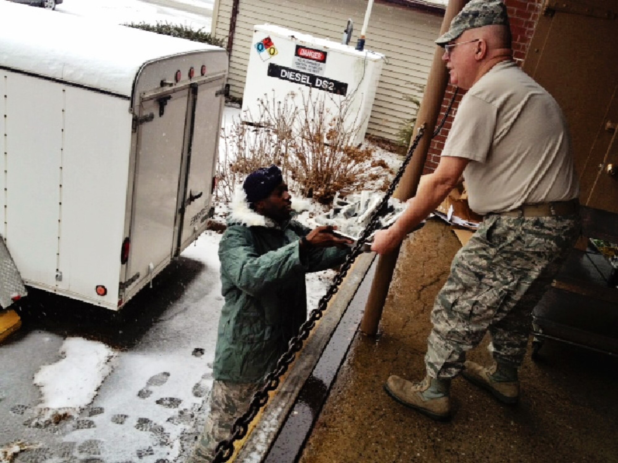 Senior Master Sgt. Chopper Lynds and members of the 102nd Force Support Flight have prepared a hot meal consisting of hotdogs and beans to distribute to various units performing 24-hour operations at Otis today. The flight has also prepared boxed lunches for tomorrow's crews. (National Guard photo by Tech. Sgt. Kerri Cole/Released)