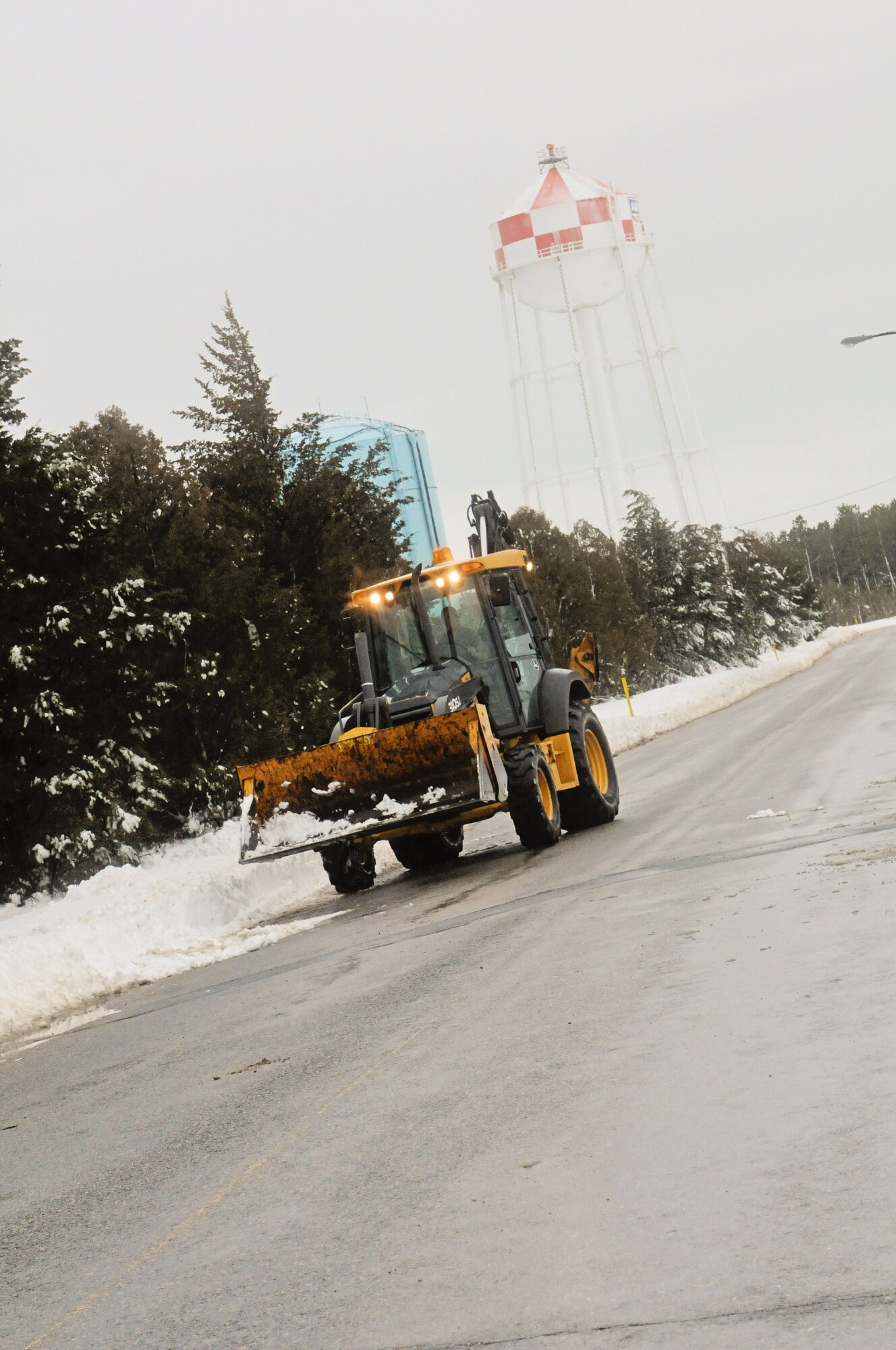 Members if the 102nd Civil Engineering Squadron remove snow on Otis Air National Guard Base after Winter Storm Nemo hit the area 8 and 9 February. (National Guard photo by Tech. Sgt. Kerri Cole/Released)