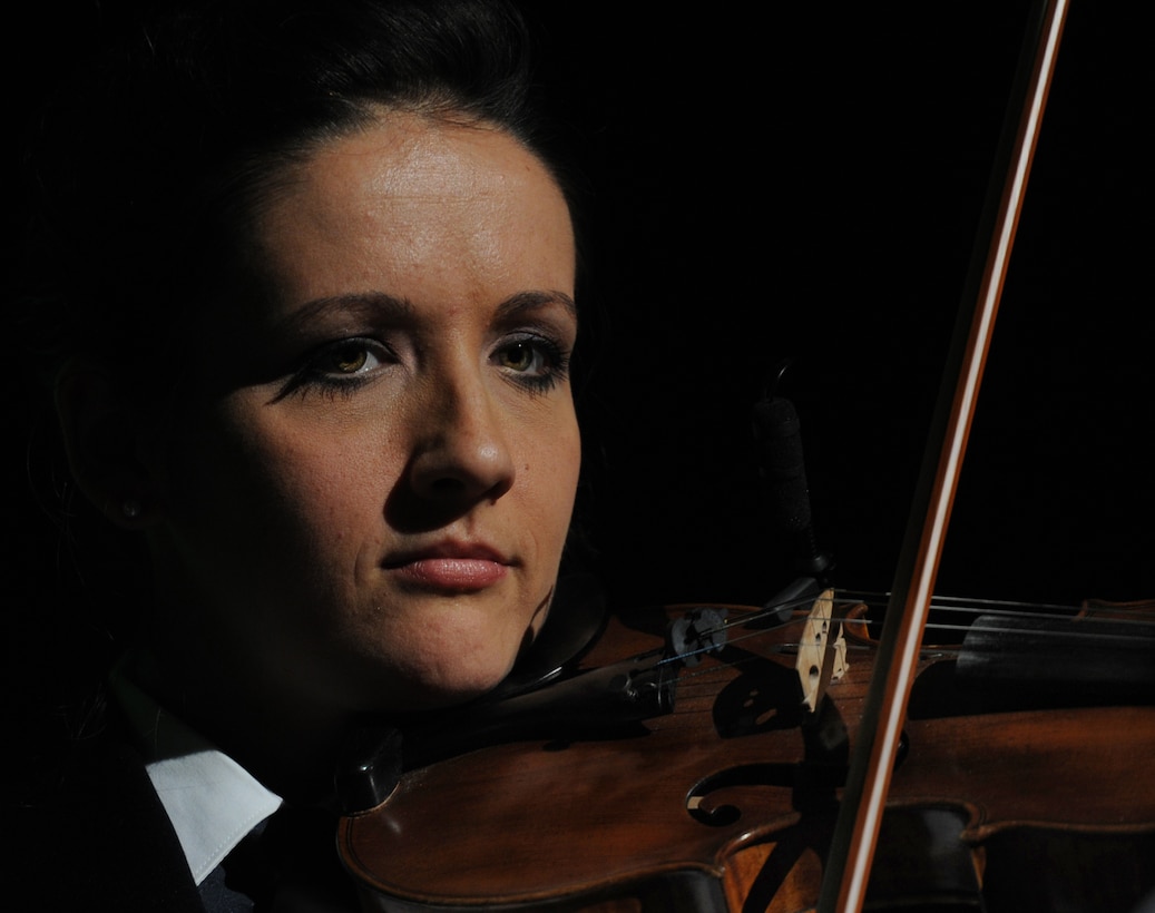 Tech Sgt. Emily Wellington, a fiddlist with The U.S. Air Force Band's Celtic Aire ensemble, performs at the Daughters of the American Revolution Constiution Hall in Washington, D.C., Feb. 24, 2013.  The Band performed with The Rouges, a Celtic rock band during their Guest Artist Series concert. (U.S. Air Force photo/ Airman 1st Class Nesha Humes)(Released)