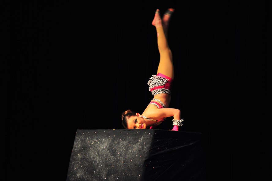 Sophie Dew, daughter of Tech. Sgt. Linda Dew, 916th Force Support Squadron, performs a tumbling routine during Team Seymour’s Showtime at the Apollo, at the base theater on Seymour Johnson Air Force Base, N.C., Feb. 22, 2013. Sophie competed against four other performers and won the children’s category. (U.S. Air Force photo/Airman 1st Class Aubrey White/Released)