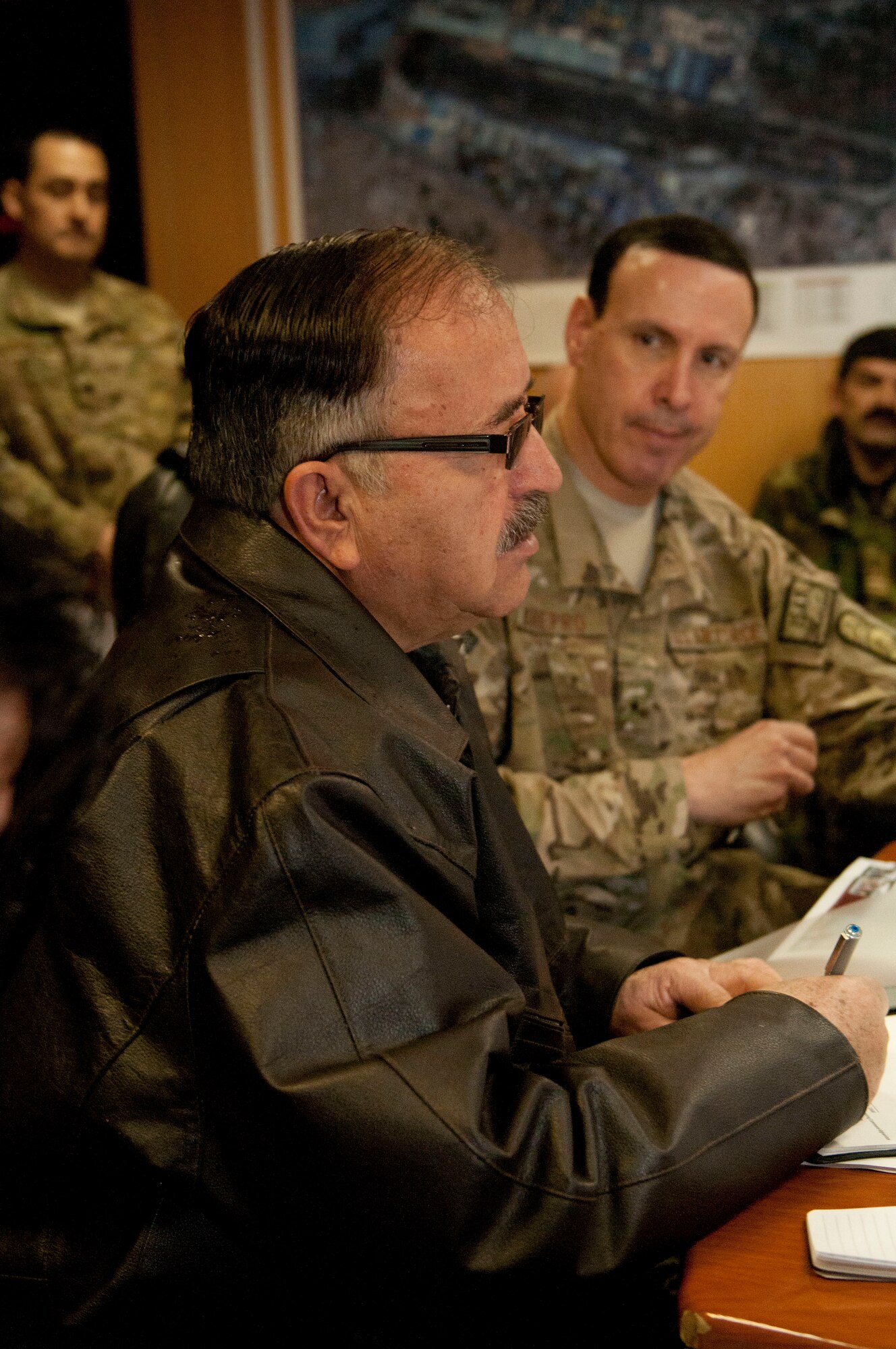 KABUL, AFGHANISTAN–Maj. Gen. Abdul Wahab Wardak, commander of the Afghan Air Force, signs documents for a historic ceremony involving the Designated Operational Capability Statement and Unit Mission Decree Feb. 26, 2013. (U.S. Air Force photo/Tech. Sgt Joseph Prouse)