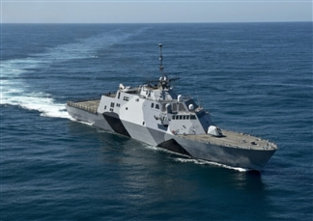 The littoral combat ship USS Freedom (LCS 1) is conducting sea trials in the Pacific Ocean off the coast of Southern California on Feb. 22, 2013.  The ship is painted in a new camouflage paint scheme of haze gray, haze white, flat black and ocean gray.  Freedom deploys on March 1st to the Western Pacific to conduct maritime security operations and participate in international exhibitions and exercises that will highlight U.S. strategic intent in the region.  