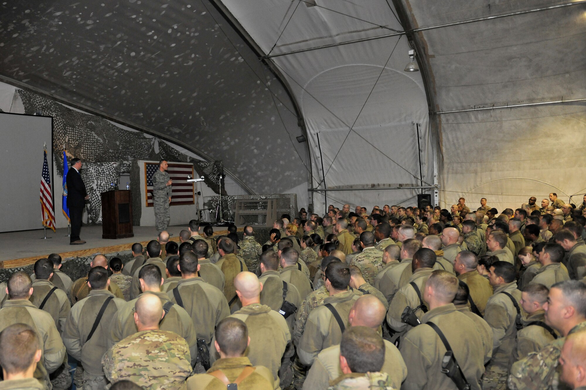BAGRAM AIRFIELD, Afghanistan -- Secretary of the Air Force Michael Donley and Chief Master Sgt. of the Air Force James Roy speak to servicemembers here Dec. 29, 2012. Donley and Roy visited BAF to emphasize the critical nature of the Airmen's mission in Afghanistan and took questions from the audience on current matters affecting the Air Force. (U.S. Air Force photo/Senior Airman Chris Willis)