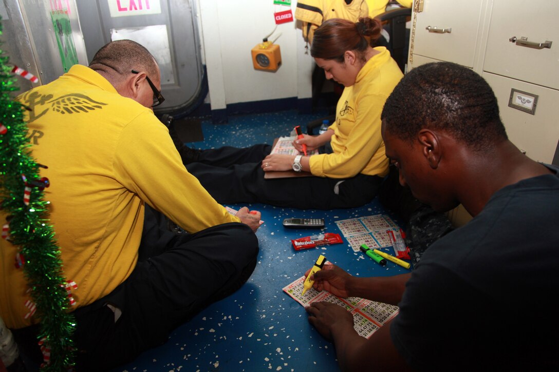 Sailors with the USS Peleliu take part in a ship-wide bingo competition aboard the ship, Dec. 18. The 15th MEU is deployed as part of the Peleliu Amphibious Ready Group as a U.S. Central Command theater reserve force, providing support for maritime security operations and theater security cooperation efforts in the U.S. 5th Fleet area of responsibility. 