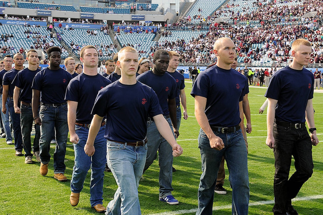 Poolees from Recruiting Station Jacksonville march onto the field before a swearing-in ceremony at a swearing-in ceremony held at EverBank Field before the Gator Bowl on January 1, 2013. Repeating of the oath and pledging their allegiance to their nation is a time honored tradition all service members perform as part of the induction process into the United States Armed Services.

The ceremony took place at the fifty yard-line of the stadium in front of  48,000 plus fans in attendance. (Official USMC photo by Pfc. John-Paul Imbody.)
