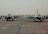 F-16 Fighting Falcons from the 35th and 80th Fighter Squadrons of the 8th
Fighter Wing, Kunsan AB, Republic of Korea; the 4th Fighter Squadron of the
388th Expeditionary Fighter Wing at Hill Air Force Base, Utah; and the 38th
Fighter Group of the ROK Air Force demonstrate an 'Elephant Walk' as they
taxi down the flightline at Kunsan Air Base, Republic of Korea, Dec. 14,
2012. The Elephant Walk was a demonstration of U.S. and ROK air force
capabilities and strength. (U.S. Air Force photo by Staff Sgt. Jonathan Fowler/Released)