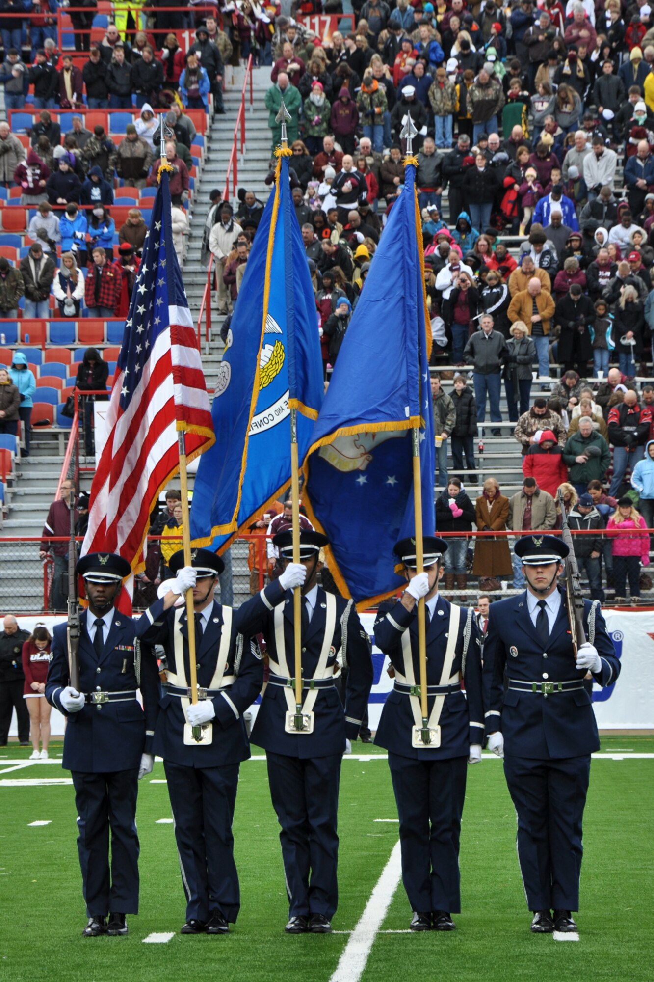 Senior Airman Darian R. James, Master Sgt. Thomas LaBarron, Senior Airman Austyn Mason, Airman 1st Class Chris Crow and Airman 1st Class Nicholas Burton, who are members of the Barksdale Air Force Base Honor Guard, present the colors for the national anthem at the Advocare V 100 Independence Bowl in Shreveport, La., Dec. 28, 2012. The Ohio Bobcats faced off against the Louisiana Monroe University Warhawks in the contest and came out with the win 45-14. The Employer Support of the Guard and Reserve donated approximately 600 hundred tickets for local military members and their families to enjoy the game. (Courtesy photo by Eva Klimentova)