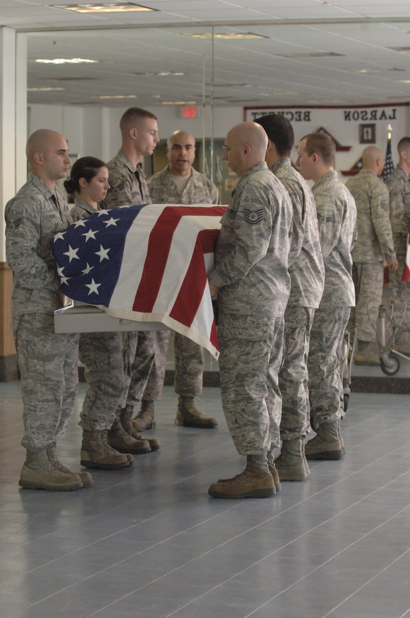 Staff Sgt. Jonathan Ramos, Joint Base Anacostia-Bolling Air Force Honor Guard instructor, guides MacDill Honor Guard members through a body bearing ceremony practice, Nov. 30, 2012. (photo by Airman 1st Class Sarah Breer/released)