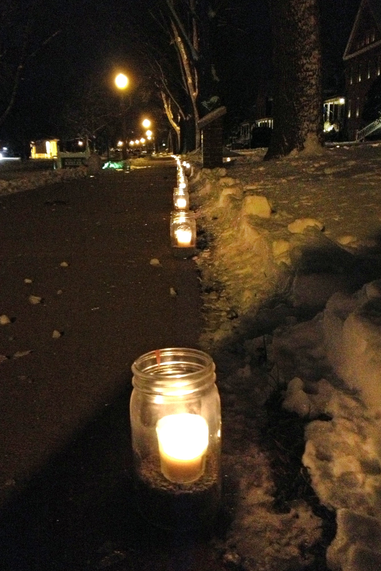 Hundreds of candles light up the sidewalk along General's Row Dec. 24 at Offutt Air Force Base, Neb. This long-time tradition, known as the luminaries, happens just once or twice a year along the row.