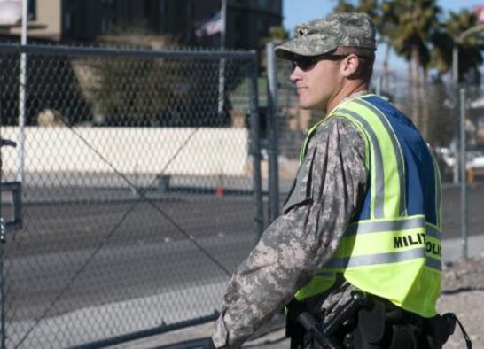 Spc. Rainier Frost of the 137th Military Police Company guards a gate in Las Vegas during Operation Vigilant Sentinel. NV ARNG photo by Spc. James Pierce, 106th Public Affairs Detachment
