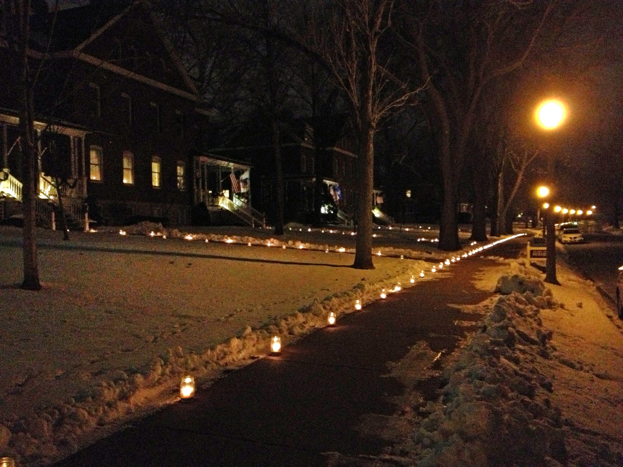 Candles light up the sidewalk along General's Row Dec. 24 at Offutt Air Force Base, Neb. This long-time tradition, known as the luminaries, happens just once or twice a year along the row.