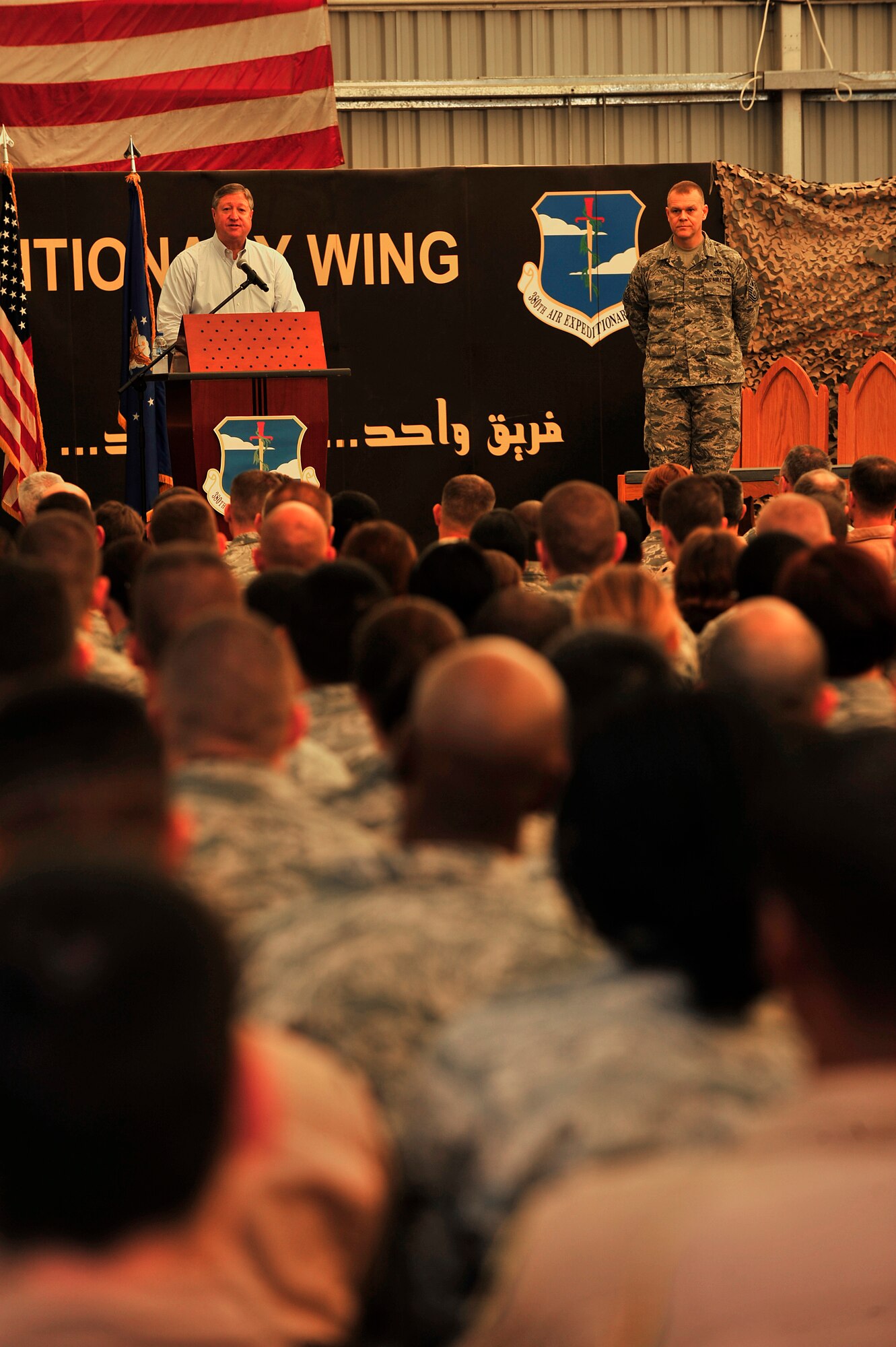 Secretary of the Air Force Michael Donley and Chief Master Sgt. of the Air Force James Roy address the men and women of the 380th Air Expeditionary Wing during an “Airman’s Call” Dec. 30, 2012. Donley and Roy highlighted the many accomplishments of the wing, to include providing 54 percent of the fuel for Operation Enduring Freedom, and discussed key topics in the Air Force, such as suicide awareness, sexual assault and digital versus analog leadership. Donley and Roy’s visit was part of a multi-base tour to meet with Airmen and deployed service members within the European and Central Command areas of responsibility.  (U.S. Air Force photo/Tech. Sgt. Christina M. Styer)

