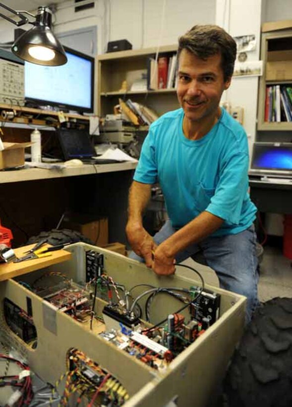 Doug Punt poses with the Cool Robot