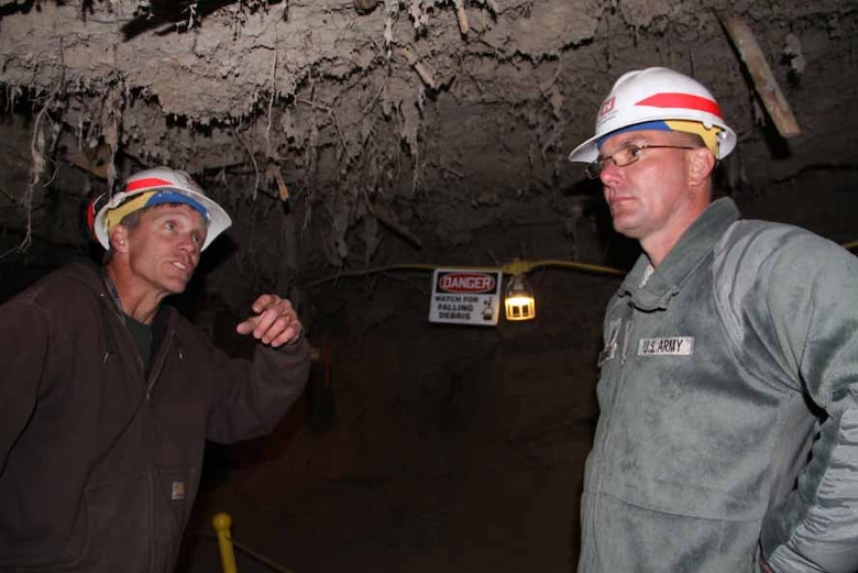 ERDC Cold Regions Research and Engineering Laboratory Researcher Kevin Bjella, on left, guides U.S. Army Corps of Engineers Command Sgt. Maj. Karl J. Groninger through the Center’s permafrost tunnel, located in Fox, Alaska.