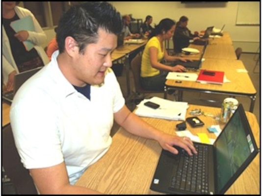 Amos Lee, a Champaign Unit 4 school teacher, loads a Tabula Digita math game as part of ERDC-CERL’s STEM program.