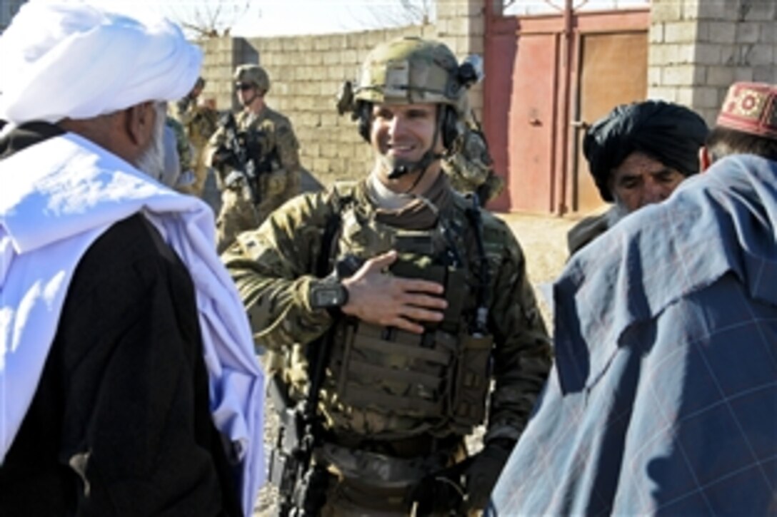 U.S. Army Capt. Jeremiah Gebhart greets Sayed Mohammed, Bala Boluk district governor, at the beginning of a meeting in the district in Afghanistan's Farah province, Jan. 2, 2013. Gebhart is a civil affairs officer with Provincial Reconstruction Team Farah, which trains, advises and assists Afghan government leaders at the municipal, district and provincial levels in Farah province. 