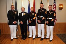 The head table for the Marine Wing Support Squadron 471 I&I staff mess night, including Ret. Maj. Gen. Gordon C. Nash, pose for a group photo on July 20. 
