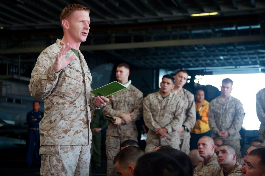 (Dec. 7, 2012) Major Mark T. Schnakenberg, staff judge advocate, 15th Marine Expeditionary Unit, briefs the rules of engagement to Marines with Kilo Company, Battalion Landing Team 3/5, 15th Marine Expeditionary Unit, in the hangar bay of the USS Peleliu, Dec. 7. Kilo Company will be going ashore to participate in a multilateral exercise with 15th MEU, French Foreign Legion, U.S. Army and Djiboutian military, titled Exercise Amitie. The 15th MEU is deployed as part of the Peleliu Amphibious Ready Group as a U.S. Central Command theater reserve force, providing support for maritime security operations and theater security cooperation efforts in the U.S. 5th Fleet area of responsibility. (U.S. Marine Corps photo by Cpl. John Robbart III)