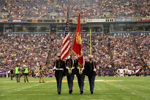 Marines with Recruiting Substation Burnsville march off of the field after performing their color guard duties at the Minnesota Vikings and Jackson Jaguars game at the Metrodome on Sept. 9. The pre-game ceremony also included 24 aspiring Marines with Recruiting Station Twin Cities taking the oath of enlistment. The 24 members of the Vikings Platoon will ship off to boot camp Sept. 10-11. For additional imagery from the event, visit www.facebook.com/rstwincities.