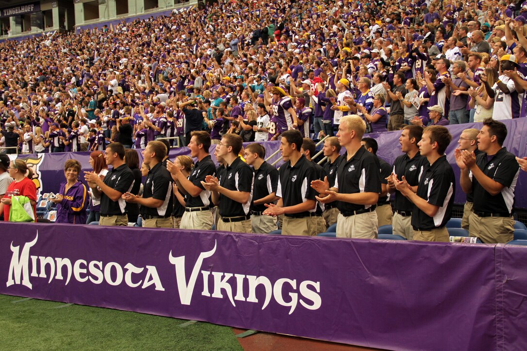 Twenty-four aspiring Marines with Recruiting Station Twin Cities watch the Minnesota Vikings battle the Jackson Jaguars after taking the oath of enlistment on Sept. 9. All 24 of the Vikings Platoon members will ship off to boot camp Sept. 10-11. For additional imagery from the event, visit www.facebook.com/rstwincities.