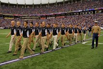 Sgt. Maj. Sean P. Cox marches 24 aspiring Marines with Recruiting Station Twin Cities off of the field after they took the oath of enlistment at the Metrodome on Sept. 9. All 24 of the Vikings Platoon members will ship off to boot camp Sept. 10-11. For additional imagery from the event, visit www.facebook.com/rstwincities. 
