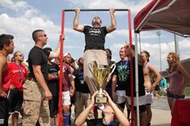 St. Cloud Rugby Football Club Coach JR Burgess knocks out more than 20 pull-ups after defeating the Robbinsdale Rugby Football Club in the championship match of the Minnesota State High School Rugby Boys Tier 2 Tournament June 10. The Steelhead beat the Lions 29-15 and went undefeated in the regular season. Last year the St. Cloud-based team placed second in the playoffs. For additional imagery from the event, visit www.facebook.com/rstwincities.