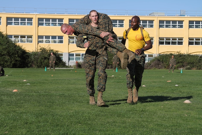 A recruit of Company H, 2nd Recruit Training Battalion, carries a fellow recruit using the fireman’s carry technique aboard Marine Corps Recruit Depot San Diego, Dec. 20. The fireman’s carry was just one exercise of many that recruits were required to do in their Combat Fitness Test.