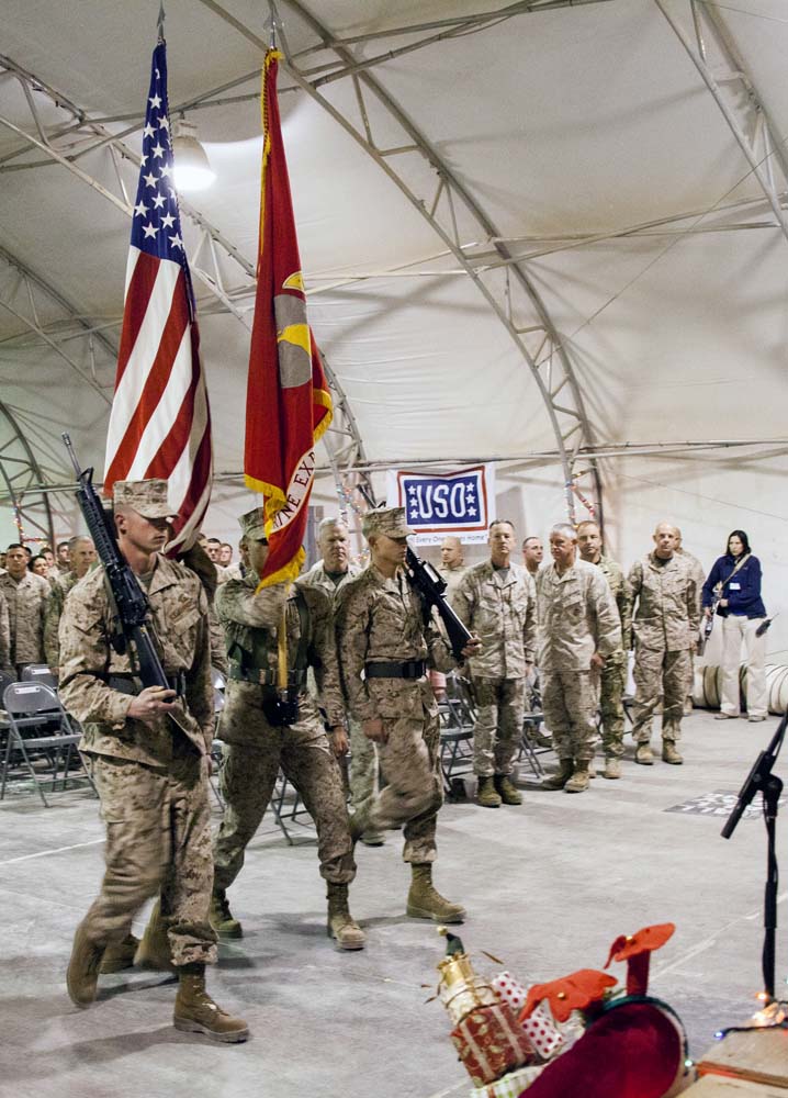 A U.S. Marine Corps color detail match on the colors during a Christmas Eve extravaganza where Commandant of the Marine Corps, Gen. James F. Amos and wife Bonnie Amos, were special guests on Camp Leatherneck, Helmand province, Afghanistan, Dec. 24, 2012. Gen. Amos and wife Bonnie spent the holidays visiting service members currently deployed to Afghanistan in support of Operation Enduring Freedom. (U.S. Marine Corps photo by SSgt. Ezekiel R. Kitandwe/Released)