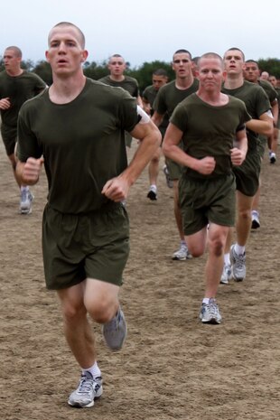 Recruits of Company K, 3rd Recruit Training Battalion, participate in sprint intervals during recruit training aboard Marine Corps Recruit Depot San Diego Dec. 18.  Drill instructors ran alongside recruits to ensure they put forth maximum effort.