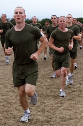 Recruits of Company K, 3rd Recruit Training Battalion, participate in sprint intervals during recruit training aboard Marine Corps Recruit Depot San Diego Dec. 18.  Drill instructors ran alongside recruits to ensure they put forth maximum effort.