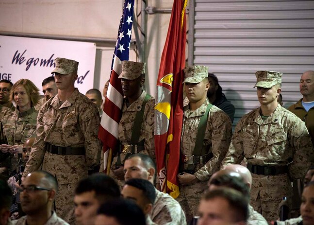 Commandant of the Marine Corps, Gen. James F. Amos and wife Bonnie Amos, address service members during a Christmas Eve extravaganza on Camp Leatherneck, Helmand province, Afghanistan, Dec. 24, 2012. Gen. Amos and wife Bonnie spent the holidays visiting service members currently deployed to Afghanistan in support of Operation Enduring Freedom. (U.S. Marine Corps photo by SSgt. Ezekiel R. Kitandwe/Released)