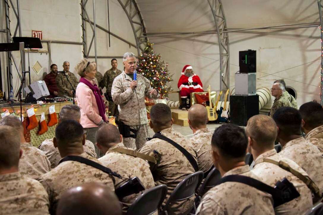 Commandant of the Marine Corps, Gen. James F. Amos and wife Bonnie Amos, address service members during a Christmas Eve extravaganza on Camp Leatherneck, Helmand province, Afghanistan, Dec. 24, 2012. Gen. Amos and wife Bonnie spent the holidays visiting service members currently deployed to Afghanistan in support of Operation Enduring Freedom. (U.S. Marine Corps photo by SSgt. Ezekiel R. Kitandwe/Released)