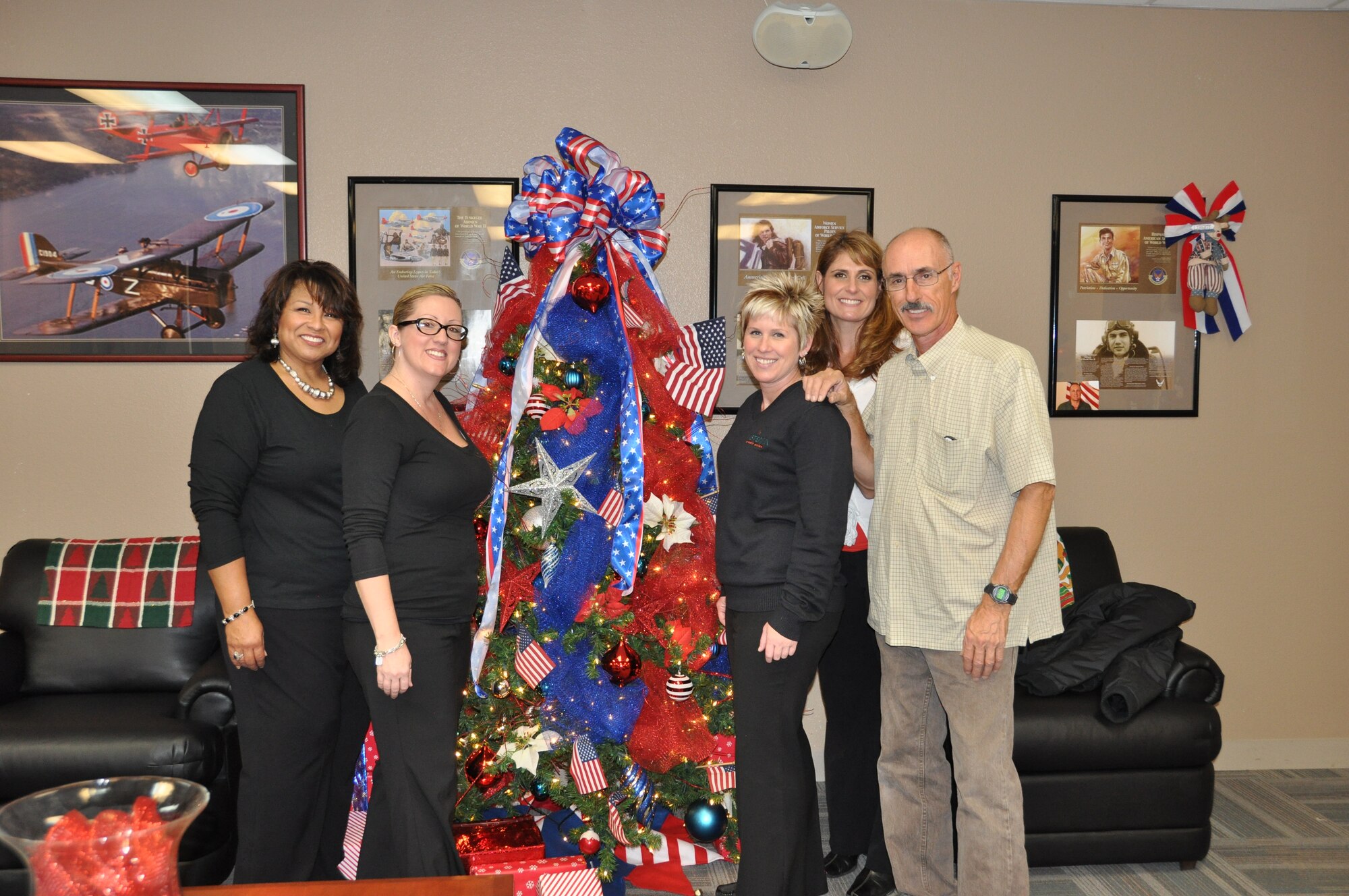 Members of the Moreno Valley Military Affairs Committee (MAC) decorate the 729th Airlift Squadron's crew lounge for the commander's holiday party held in December. 
(U.S. Air Force photo by Megan Crusher)
