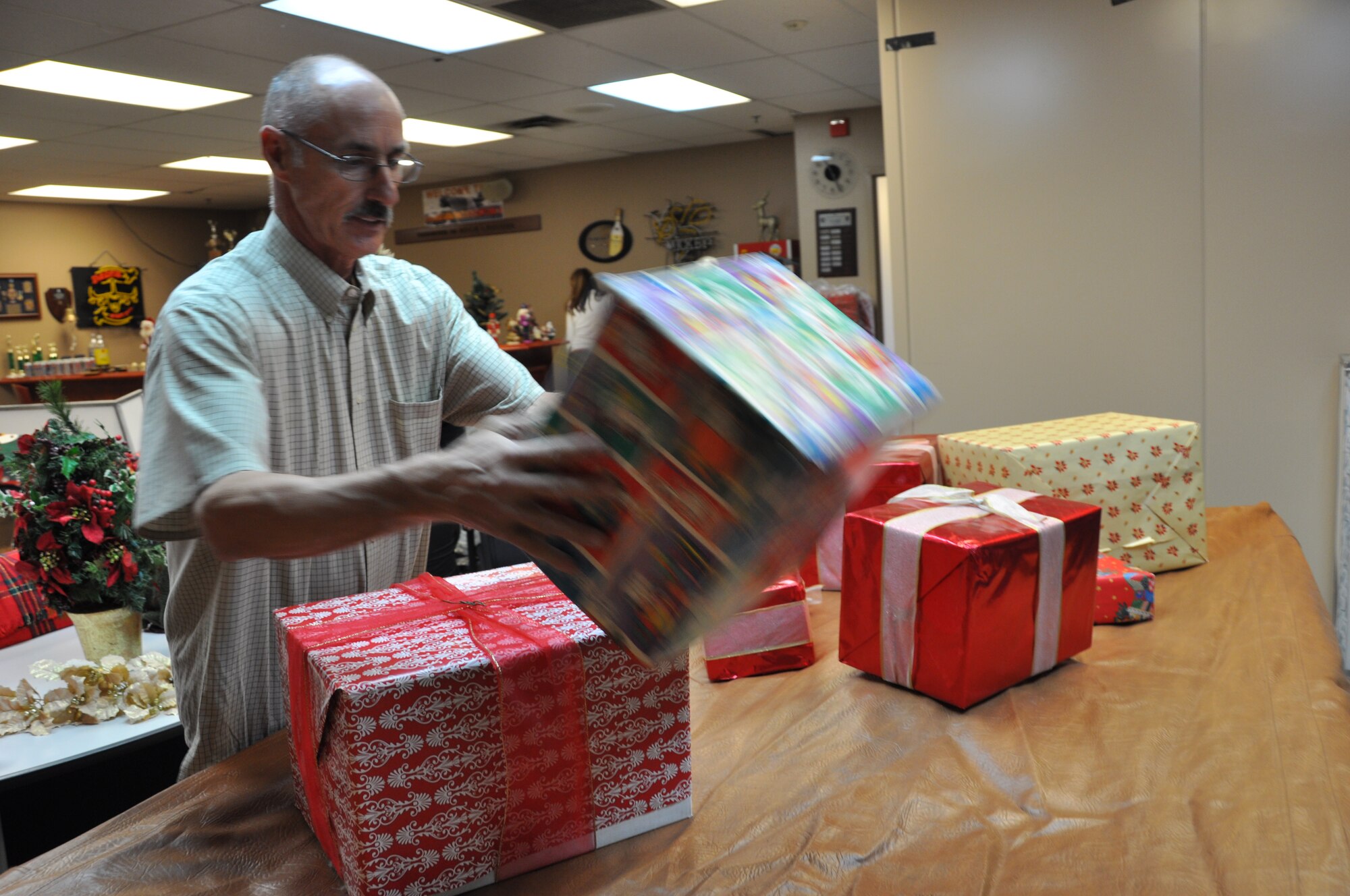 Members of the Moreno Valley Military Affairs Committee (MAC) decorate the 729th Airlift Squadron's crew lounge for the commander's holiday party held in December. 
(U.S. Air Force photo by Megan Crusher)
