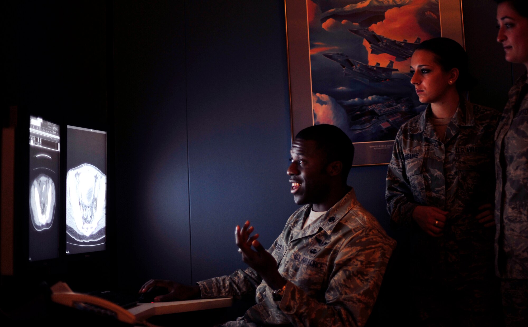 Lt. Col. Joseph Beard, 779th Medical Group Diagnostic Imaging Phase II Course Medical director, explains an X-Ray image to Airmen Sarah Fairbanks and Ashley Watson on Dec. 19, 2012. The Airmen are Diagnostic Imaging students completing their last phase of training. (U.S. Air Force photo/ Airman 1st Class Erin O’Shea) 