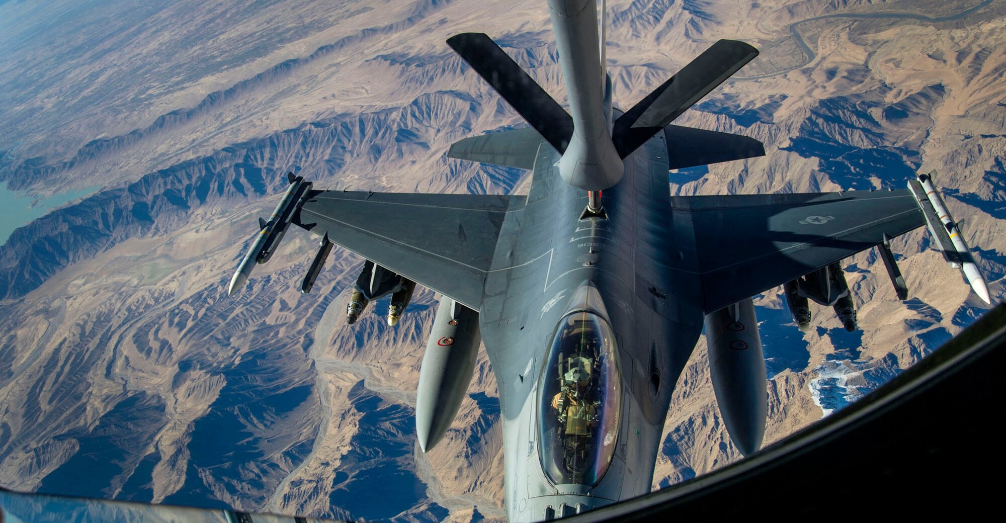 A KC-135 Stratotanker refuels an F-16 Fighting Falcon over Afghanistan, on Dec. 22, 2012. The F-16 Fighting Falcon, deployed from Shaw Air Force Base, S.C., received fuel to conduct missions in support of Operation Enduring Freedom. The KC-135 Stratotanker is from the 340th Expeditionary Air Refueling Squadron. (US Air Force photo/Staff Sgt. Ashley Reed)