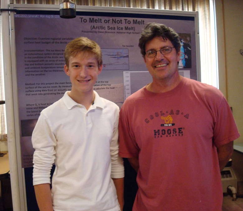 ERDC Cold Regions Research and Engineering Laboratory student Owen Brennick poses with his former Richmond Middle School Science Teacher Cliff Harriman. This year Brennick was a volunteer and hopes to return again next year.