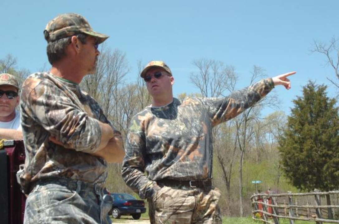 William “Mike” White, founder of Camp Hope for wounded warriors, left, chats with Army Capt. Joe Bogart, a wounded warrior who said the camp restored his sense of independence. U.S. Army photo by Michael William Petersen 