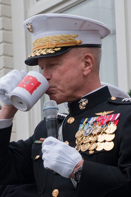 Gen. James F. Amos, commandant of the Marine Corps, drinks hot, spiced rum from his mug after the U.S. Marine Band’s performance during the traditional New Year’s Day serenade in the garden of the Home of the Commandants at Marine Barracks Washington Jan. 1.