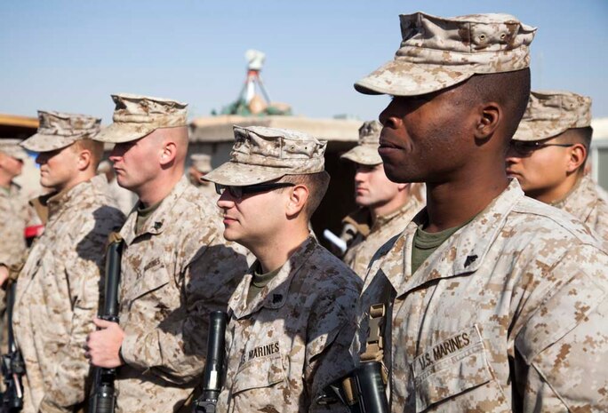 U.S. Marine Corps Cpl. Brandon C. Harper, right, with Headquarters Company, Regimental Combat Team 7 (RCT-7), stands in formation on Camp Leatherneck, Helmand province, Afghanistan, Jan. 1, 2013. The Marines and Sailors with RCT-7 are currently deployed to Afghanistan in support of Operation Enduring Freedom. (U.S. Marine Corps photo by Staff Sgt. Ezekiel R. Kitandwe/Released)