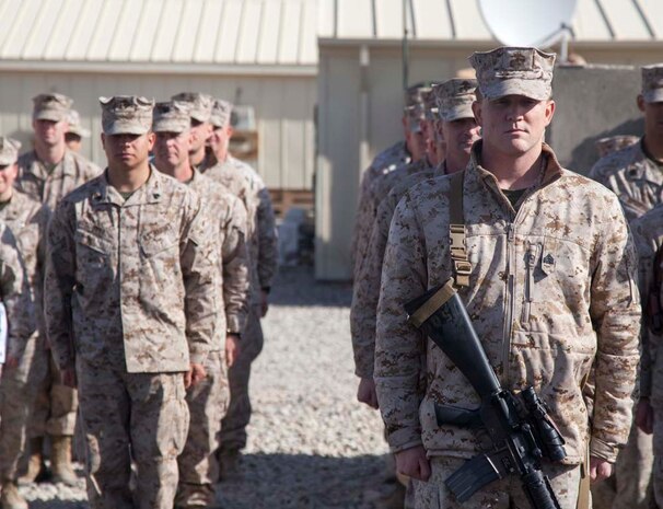U.S. Marines with Headquarters Company, Regimental Combat Team 7 (RCT-7), stand in formation during a promotion and reenlistment ceremony on Camp Leatherneck, Helmand province, Afghanistan, Jan. 1, 2013. The Marines and Sailors with RCT-7 are currently deployed to Afghanistan in support of Operation Enduring Freedom. (U.S. Marine Corps photo by Staff Sgt. Ezekiel R. Kitandwe/Released)