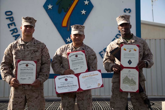 Newly promoted U.S. Marines with Headquarters Company, Regimental Combat Team 7 (RCT-7), display their promotion warrants after a promotion ceremony on Camp Leatherneck, Helmand province, Afghanistan, Jan. 1, 2013. The Marines and Sailors with RCT-7 are currently deployed to Afghanistan in support of Operation Enduring Freedom. (U.S. Marine Corps photo by Staff Sgt. Ezekiel R. Kitandwe/Released)
