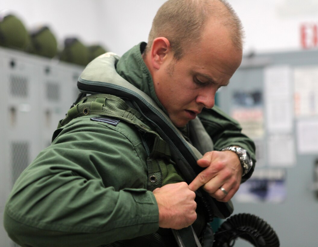 Flight Lt. Daniel Shaw, a Royal Air Force/United States Marine Corps Pilot Exchange officer with Marine Fighter Attack Training Squadron 101, 3rd Marine Aircraft Wing, and a London, native, prepares for a flight Dec. 20. Shaw, who is in the British Royal Air Force, is training to fly the F/A-18 Hornet while learning the tactics of the Marine Corps as part of the program.