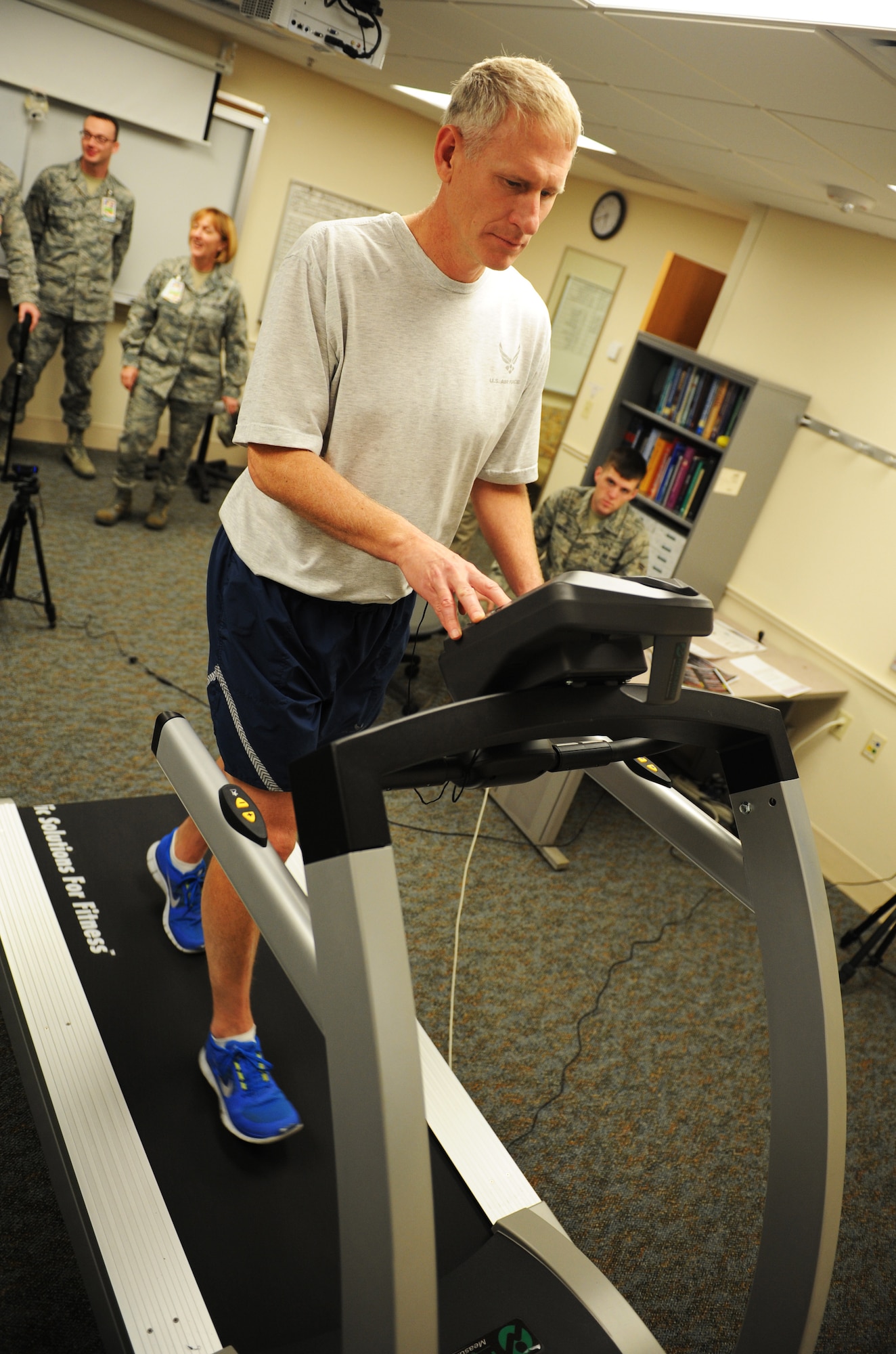 Col. David Almand, 375th Air Mobility Wing commander, performs physical therapy exercise Jan. 3 during his visit to the 375th Medical Group.  The treadmill analized Almand's running gait.  Gait analysis is a method used to assess the way we walk or run to highlight biomechanical abnormalities.  (U.S. Air Force photo/Staff Sgt. Maria Bowman)
