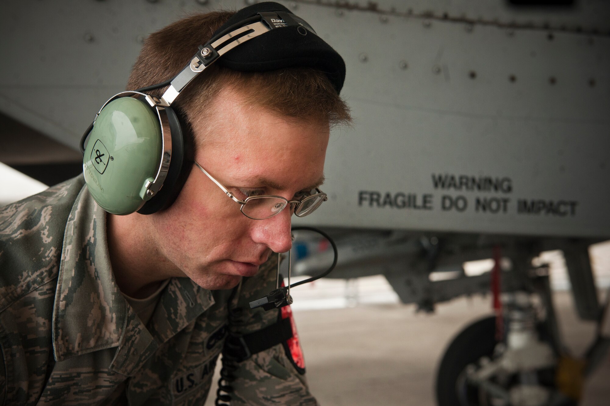 U.S. Air Force Senior Airman Joshua Turner, 75th Aircraft Maintenance Unit weapons load crew member, performs routine maintenance on an A-10C Thunderbolt II at Moody Air Force Base, Ga., Jan. 3, 2013. Turner performed a selective jettison and emergency jettison check to ensure the aircraft was ready to fly. (U.S. Air Force photo by Airman Alexis Grotz/Released)