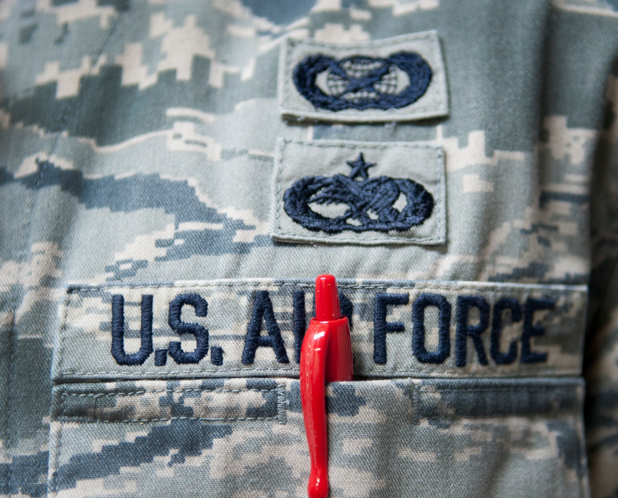 Though red pens are often seen as leaving negative remarks on one's career, they are in fact used as tools to help better Airmen. From fixing aircraft to correcting papers, each stroke makes a mark in pursuing excellence. (U.S. Air Force photo by Senior Airman Daniel Phelps/Released)