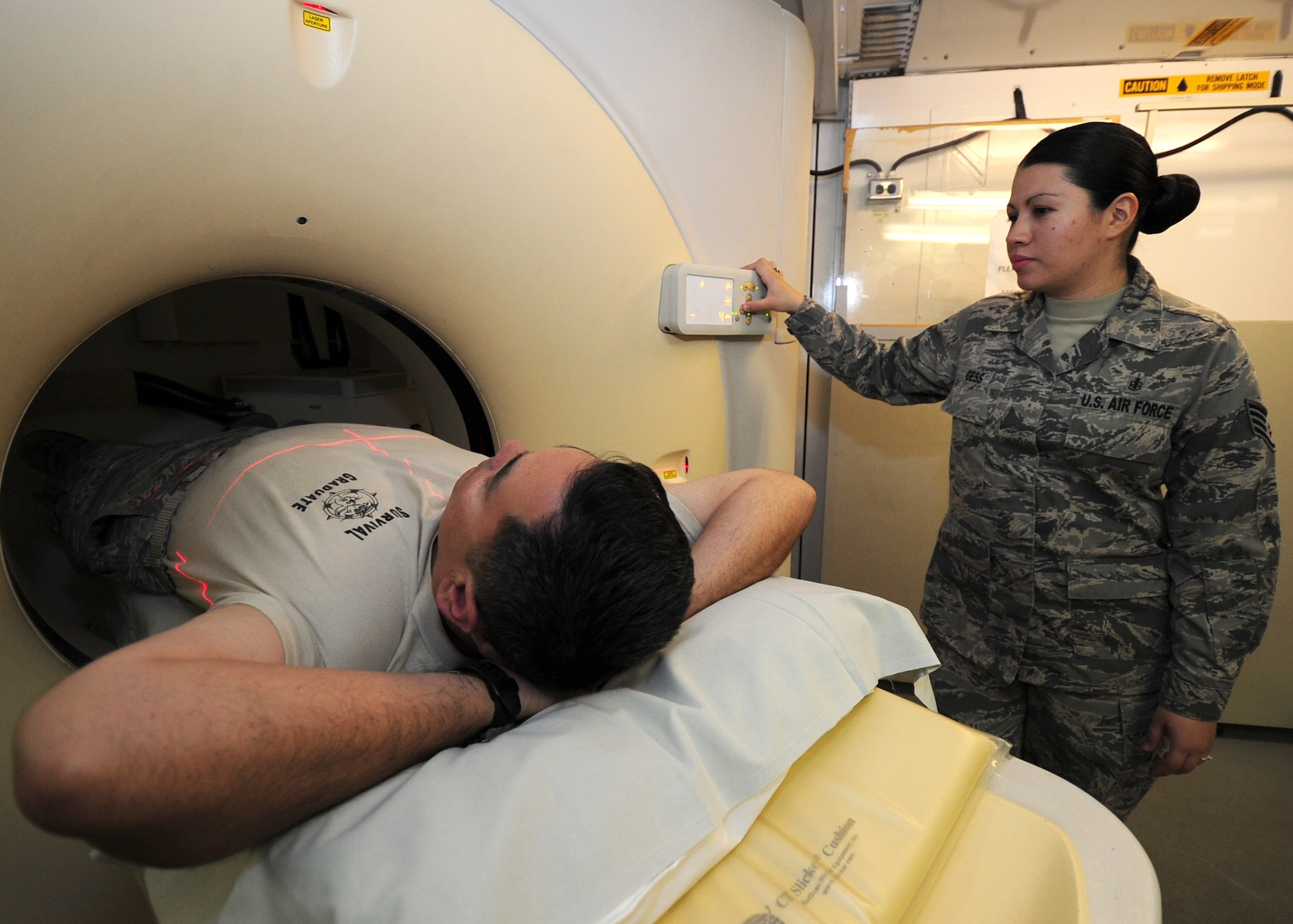 SOUTHWEST ASIA – Staff Sgt. Charlie Gess, 379th Expeditionary Medical Group diagnostic imaging technologist, performs a computed tomography scan. A CT is a specialized exam, which allows for more complex views of the body area being examined. This procedure requires upwards of six additional months of training to perform. Most technicians will have undergone upwards of two years of training before they are deployed. Gess is deployed from Wright-Patterson Air Force Base, Ohio. (U.S. Air Force photo/Master Sgt. Brendan Kavanaugh)