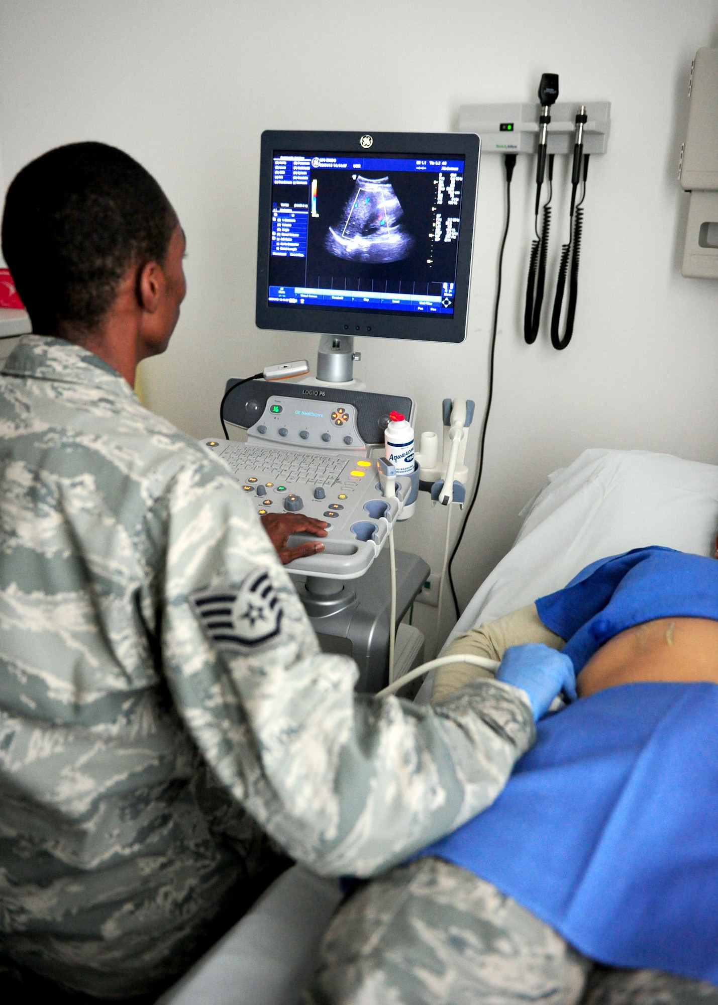 SOUTHWEST ASIA – Staff Sgt. Morrell Colquitt, 379th Expeditionary Medical Group ultrasound technologist, performs an ultrasound on a patient. This technology enables evaluation of specific internal organs of a patient. Colquitt is a native of Valdosta, Ga., and is deployed from MacDill Air Force Base, Fla. (U.S. Air Force photo/Master Sgt. Brendan Kavanaugh)