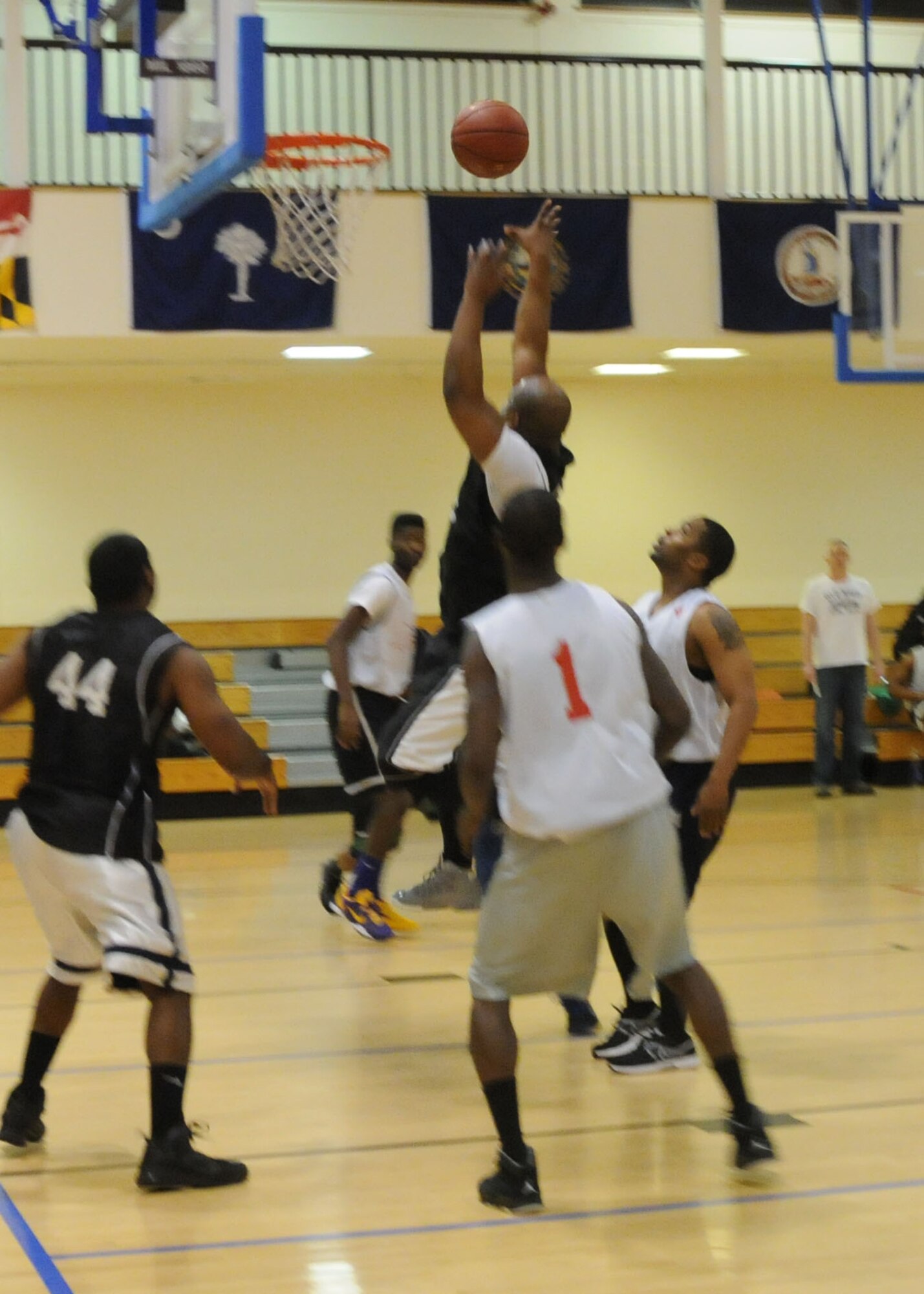 Staff Sgt. Branden Conerly, 352nd Special Operations Support Squadron A6 data technician from New Orleans, goes for a layup during a basketball game against the 100th Maintenance Group Jan. 3, 2013, at the Hardstand Fitness Center on RAF Mildenhall, England. The 100th MXG won the game 59-32. The intramural basketball season will continue through the end of February. (U.S. Air Force photo by Airman 1st Class Kelsey Waters/Released)