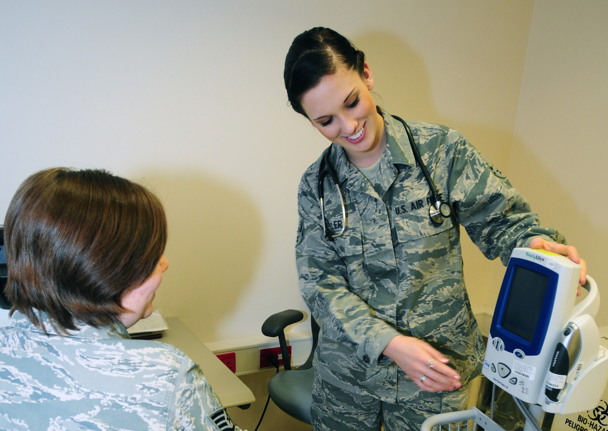 ROYAL AIR FORCE LAKENHEATH, England - Airman 1st Class Sarah Miller, 48th Aerospace Medical Squadron public health technician, checks the blood pressure of Staff Sgt. Samantha Plemons, 48th Aerospace Medical Squadron public health supervisor, for training purposes Jan. 3, 2012. Miller was nominated for a Liberty Spotlight because she displays the core value of "Service Before Self." (U.S. Air Force photo by Airman 1st Class Dana J. Butler) 

